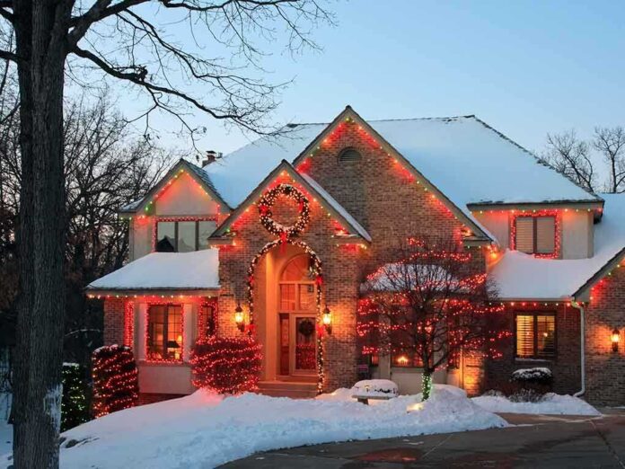 shutterstock_42736285.jpg A beautifully decorated house with Christmas lights in a snowy setting