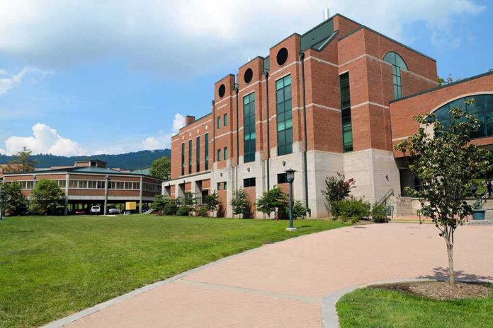 Modern educational building on a college campus with landscaped grounds