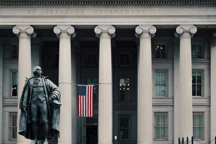 1240657660 US Treasury Department building with statue and flag.