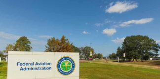 Federal Aviation Administration sign on grassy lawn