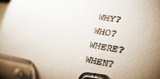 Close-up of a typewritten page with four questions: Why?, Who?, Where?, When?