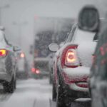 Power Grid COLLAPSE Threatens Northeast Cars stuck in traffic during a snowstorm with snow covering the vehicles
