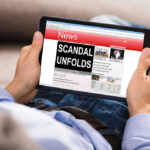 SCANDAL: LAWMAKER’S Sickening Acts Rock Community Person reading tablet with headline Scandal Unfolds.
