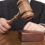 Shocking Verdict: Ex-Porn Star’s Sentence A judge holding a gavel above a wooden block