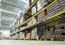 Interior view of a warehouse with stacked shelves of packaged goods