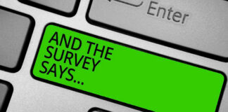 Green key with AND THE SURVEY SAYS