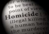 Magnified text showing definition of homicide.
