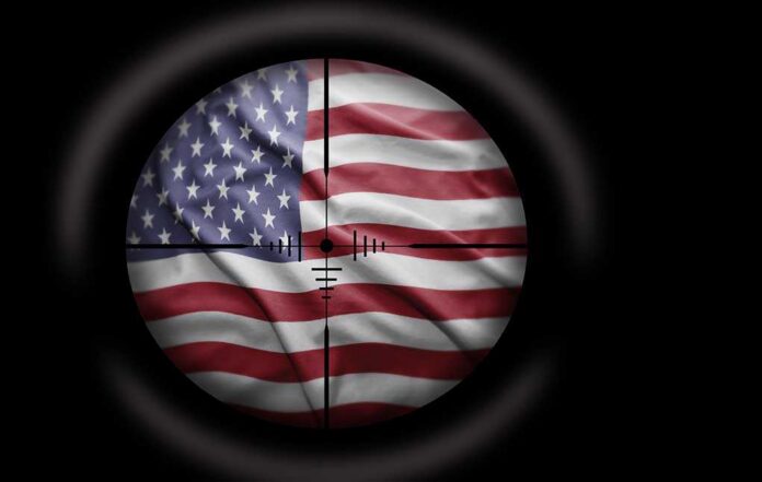 shutterstock_186857996.jpg View of the American flag through a sniper scope