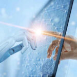 Robotic and human hands touching through a screen.