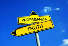 Yellow signs: Propaganda left, Truth right. Blue sky background.