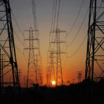 Transmission towers at sunset.