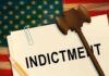 A legal document labeled INDICTMENT with a gavel and pencil