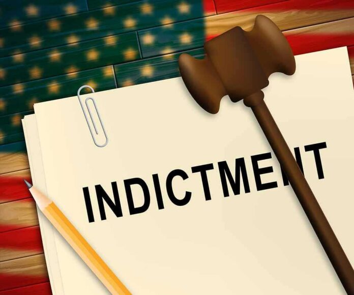 A legal document labeled INDICTMENT with a gavel and pencil