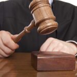 Trump Administration WINS Major AI Battle A judge holding a gavel above a wooden block