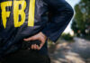 FBI Visits Brewery After Trump Death Post FBI agent holding a gun behind the back.