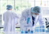 Defense Department Quietly Changes Course Scientists working in a laboratory with test tubes
