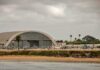 Fog of War: Iranian Attack on U.S. Base airport hangar with helicopters near a shoreline