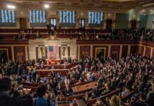 Competing Election Narratives Fuel Growing Public Distrust A crowded congressional chamber with members in discussion