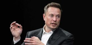 man in a suit speaking with hand gestures