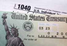 Special Tax Exemption for US Companies Sparks Fury Close-up of a U.S. Treasury check and tax form 1040