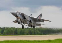 Military jet taking off from runway