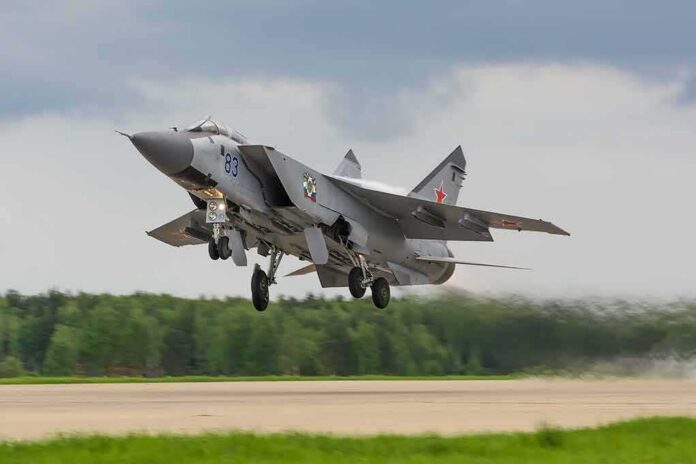 Military jet taking off from runway