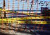 Nature Reserve Shock: Man Admits Public Indecency Charge Orange safety net and yellow police tape blocking a beach access