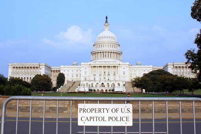 View of the U.S. Capitol building with a security barrier in front
