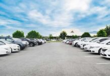 Bakersfield Mall Starts Charging for Prime Parking Parking lot lined with cars under a blue sky