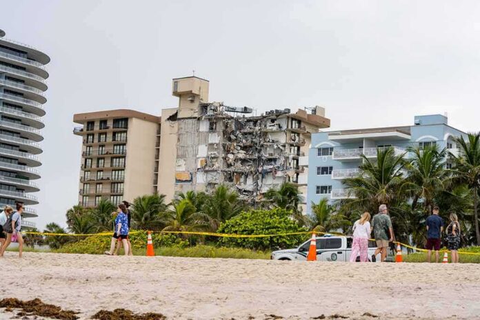Partially collapsed beachfront condominium building