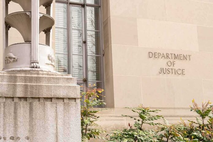 shutterstock_2271133921 Department of Justice building facade with stone sign and window