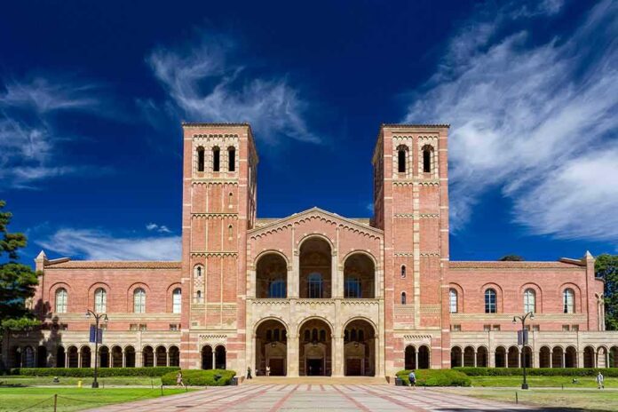 Brick collegiate building with twin towers and arched entrance