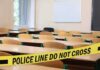 Florida Teacher Accused of Kicking Student With Disabilities Empty classroom with police tape across desks