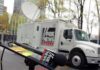 Fox News microphone and satellite truck on city street
