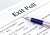 Close-up of an exit poll survey form with a pen